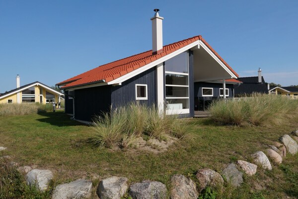 Foto van Beaside Wellness Chalet voor 10 personen - Vakantiehuis in Großenbrode - ExteriorSummer