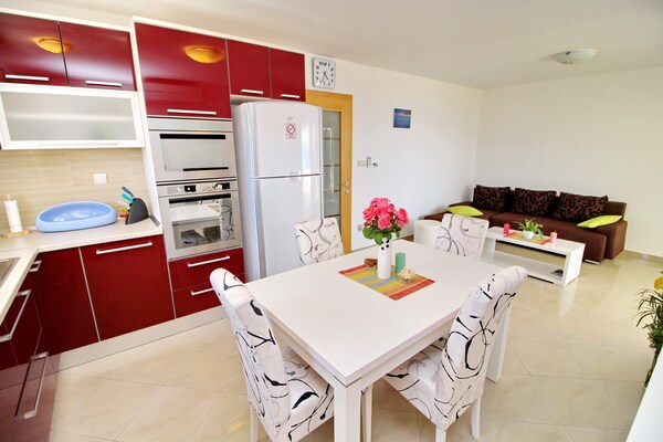 Foto van Apartments Gusti - Two-Bedroom Apartment with Balcony and Sea View - Kitchen