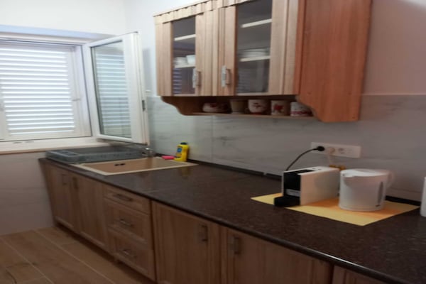 Foto van Apartments Kalajzic - Two Bedroom Apartment with Garden and Terrace(A2) (ST) - Kitchen