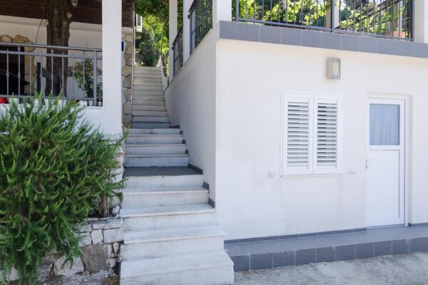Foto van Apartments Ammos - Studio Apartment with Shared Terrace and Sea View - Landing