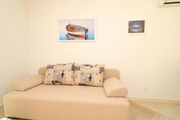 Foto van Apartments Seafront Silence - One Bedroom Apartment with Terrace and Sea View - LivingRoom