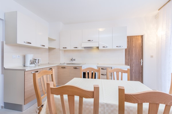 Foto van Comfortabel appartement met terras en tuin - Vakantiehuis in Medulin - Kitchen