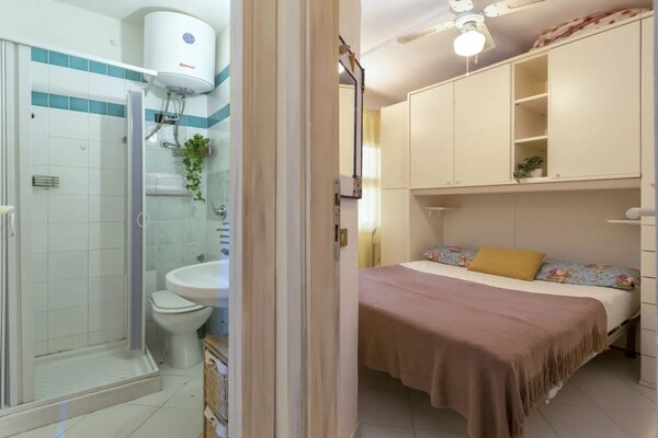 Foto van Appartement in Marinella vlakbij het strand - Vakantiehuis in Marinella - BedRoom