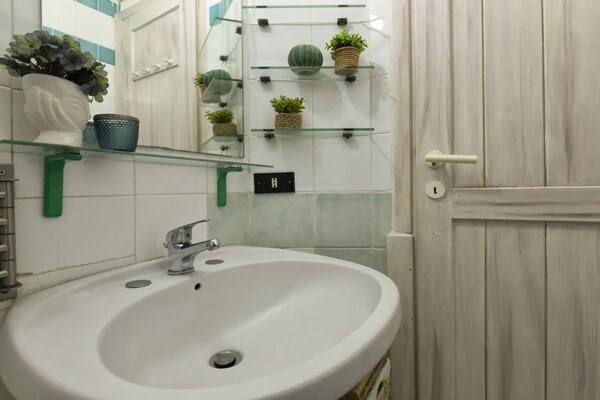 Foto van Appartement in Marinella vlakbij het strand - Vakantiehuis in Marinella - BathRoom