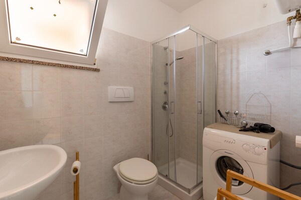 Foto van Appartement met airconditioning en terras - Vakantiehuis in Castelsardo - BathRoom