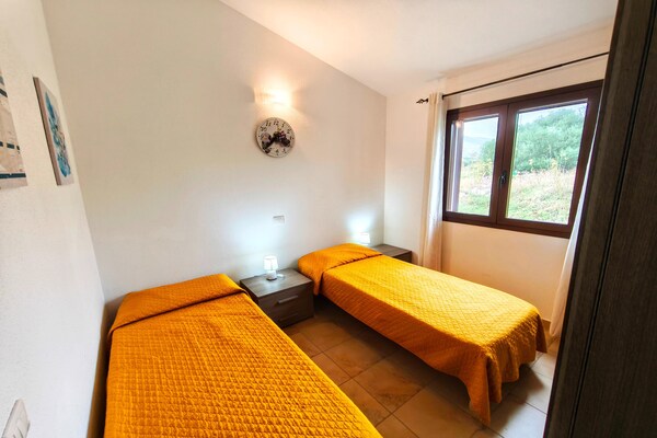 Foto van Appartement met terras met zeezicht - Vakantiehuis in Budoni - BedRoom