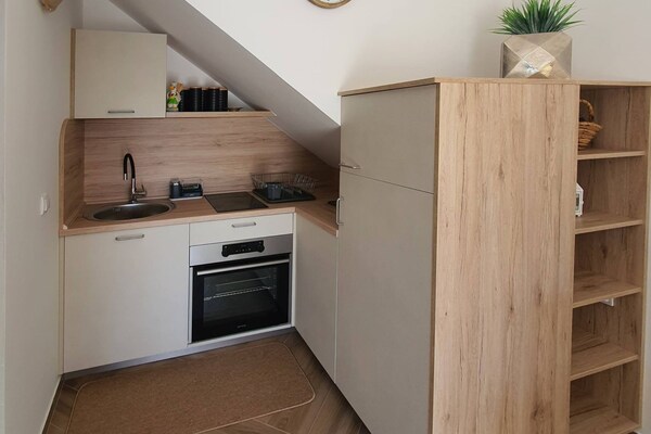 Foto van Comfort Accommodation Baošići Montenegro-One Bedroom Apartment with Terrace and Sea View (2) - Kitchen