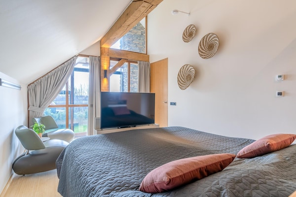 Foto van Stijlvol overnachten met hottub & sfeerhaard. - Vakantiehuis in De Koog - BedRoom